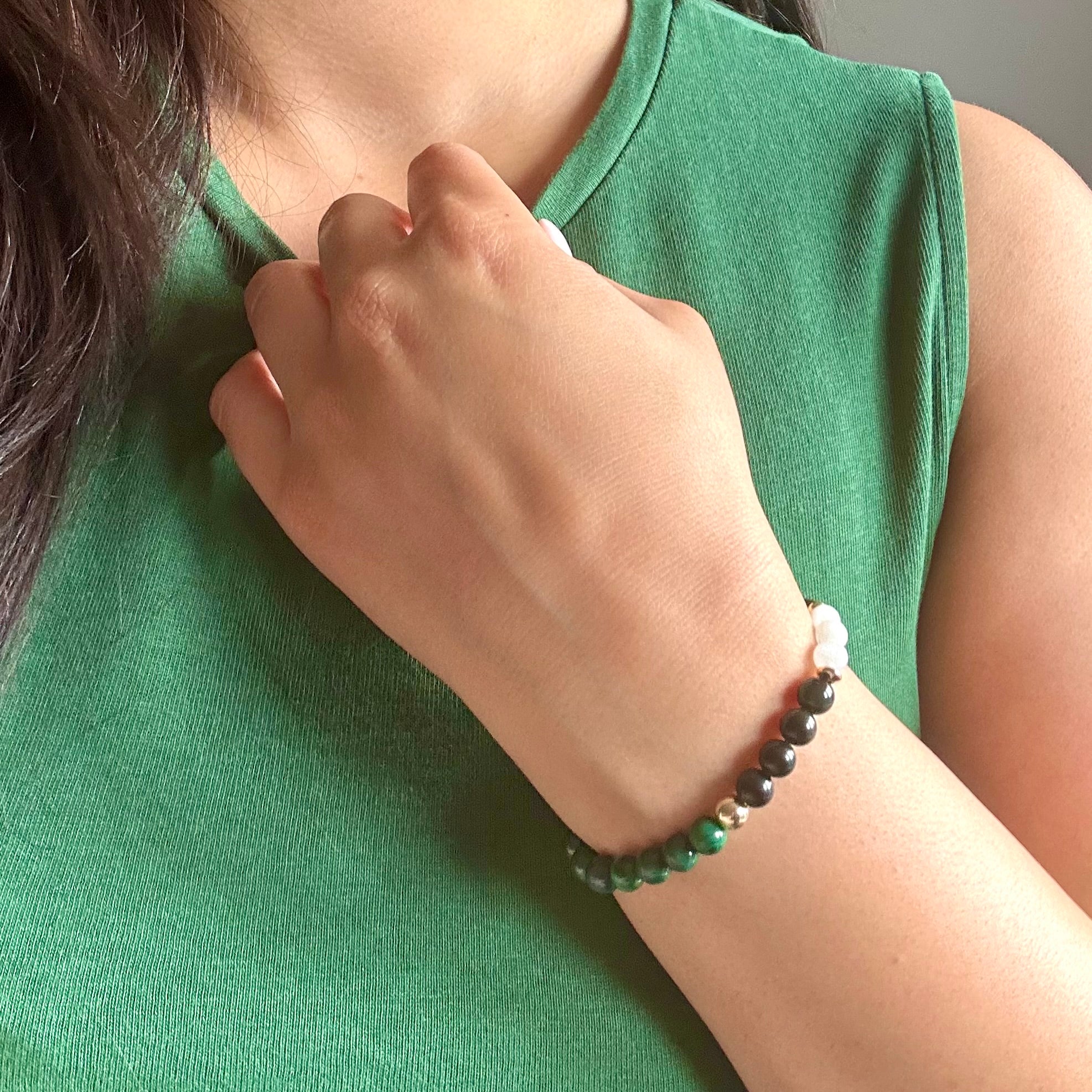 Malachite, Moonstone & Obisidian. This bracelet is not only stylish, it also is great for those who are working on their future and want / need all the protection they can get.