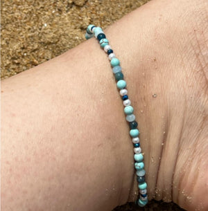 Perfect beach holiday anklet. Turquoise helps with calmness, tranquillity, creativity, and empathy. It represents wisdom, tranquillity, protection, good fortune, and hope.  Aquamarine helps us to gain insight, truth, and wisdom. It can be used to help calm the mind, nerves, and anxieties.  Blue Apatit is a stone of man